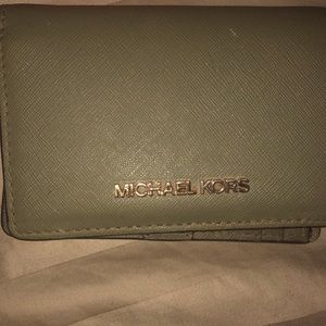 Opened box but never used green with gold accent logo stitching on the inside